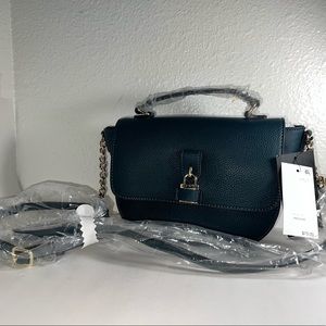 Nemi top handle crossbody designed with a top handle and flap design